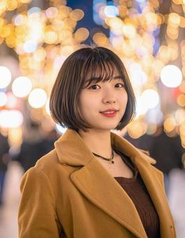 イルミネーションと彼女の写真