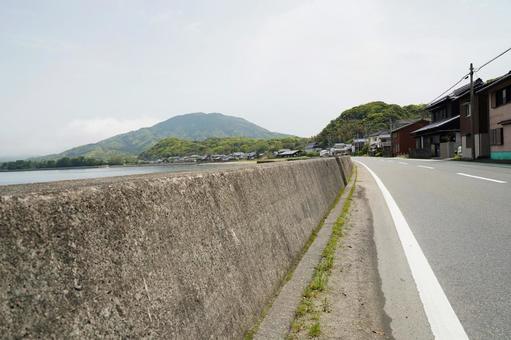福岡 糸島 防波堤沿いの道1 防波堤,道路,街並みの写真素材