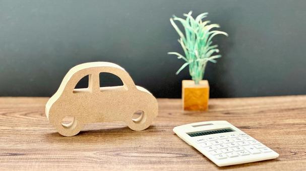 車の小物と計算機_茶板黒背景 車の小物と計算機_茶板黒背景 車,計算機,電卓の写真素材