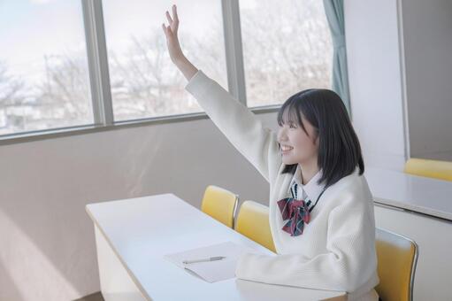 手を上げる学生 女子学生,学生,制服の写真素材