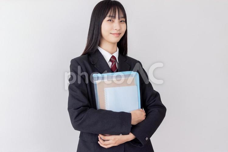 勉強道具を持つ女子高生 女性,高校生,人物の写真素材