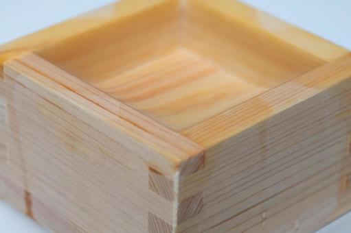 伝統的な木製の枡のクローズアップ 枡,酒器,和風の写真素材