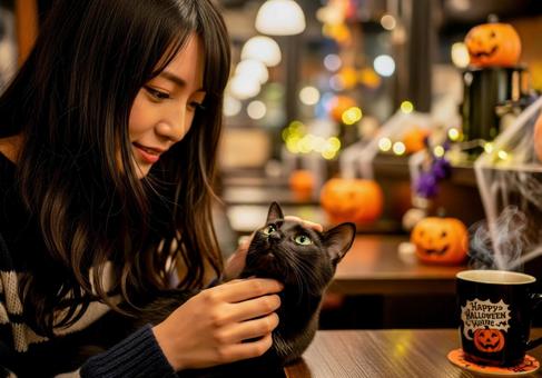 黒猫と女性が過ごすハロウィン猫カフェ 黒猫と女性が過ごすハロウィン猫カフェ 黒猫,女性,カフェの写真素材