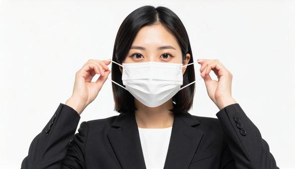 マスクをつける人 マスクをつける人の写真