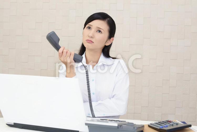 疲れた表情のビジネスウーマン 女性,ビジネウーマン,女の写真素材