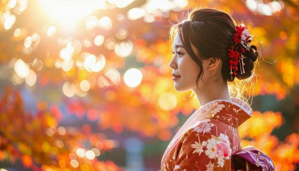 紅葉を眺める晴れ着姿の女性のポートレートの写真