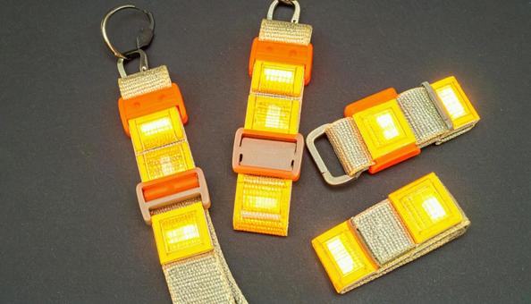 Reflective sashes and key chains for safety and nighttime use, at night, reflective material, traffic, JPG