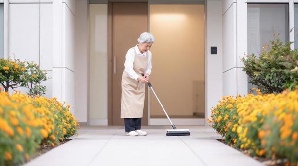 花壇と女性清掃員#08Aiの写真