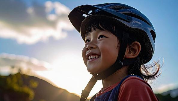 自転車用ヘルメットをかぶる女の子 自転車用ヘルメットをかぶる女の子の写真