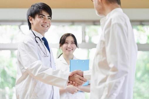 Male doctor pleased to be discharged, discharge, handshake, doctor, JPG