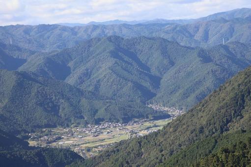 空と山あいの集落のある村の見える風景 空,山あい,集落の写真素材