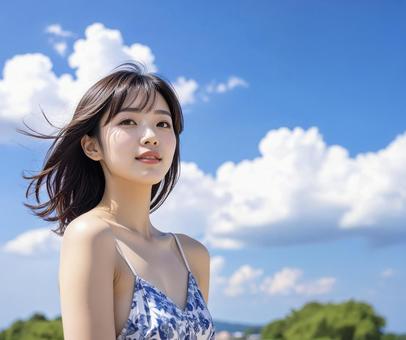 若い女性 夏の青空 若い女性 夏の青空の写真