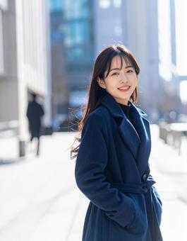 冬の朝・コートで出勤の彼女 冬の朝・コートで出勤の彼女の写真
