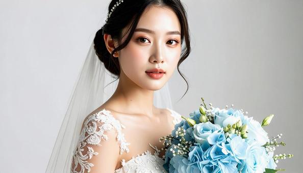 花嫁と水色のブーケの写真