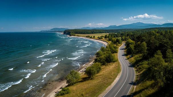 青い海とカーブの道の写真