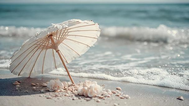 白い和傘と貝殻が映える夏の海辺の風景 白い和傘と貝殻が映える夏の海辺の風景の写真