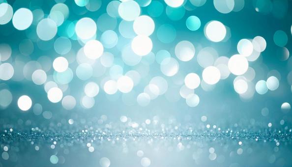 蒼緑とシルバーのボケ効果の背景の写真