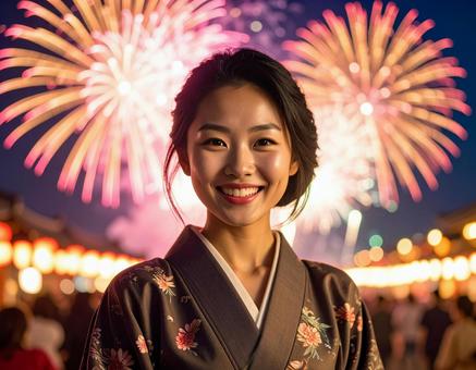 花火をバックに笑顔の日本人女性 花火をバックに笑顔の日本人女性の写真