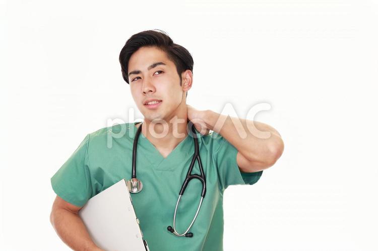 疲れた表情の医師 男性,男,医師の写真素材