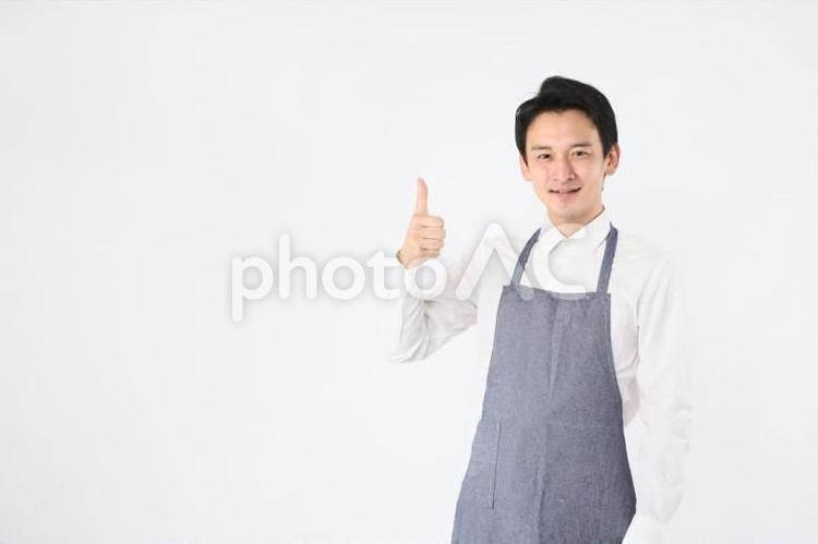 エプロンをつけた男性 飲食店,スタッフ,店員の写真素材
