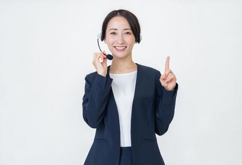 ヘッドセットをつける女性 ヘッドセットをつける女性 オペレーター,ビジネス,ヘッドセットの写真素材