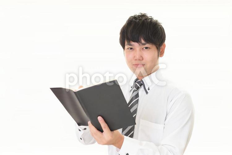 ノートを持つ男性 ビジネス,ビジネスマン,男性の写真素材