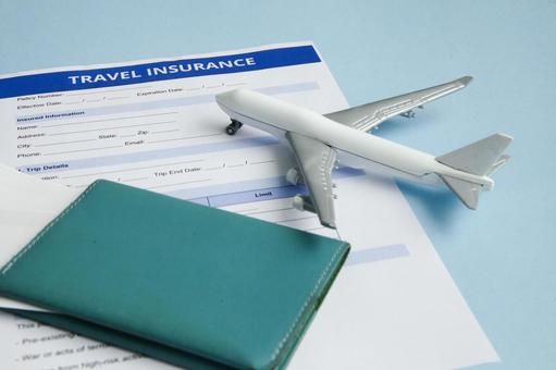 旅行の保険モチーフ　飛行機 契約,申請,記入用紙の写真素材