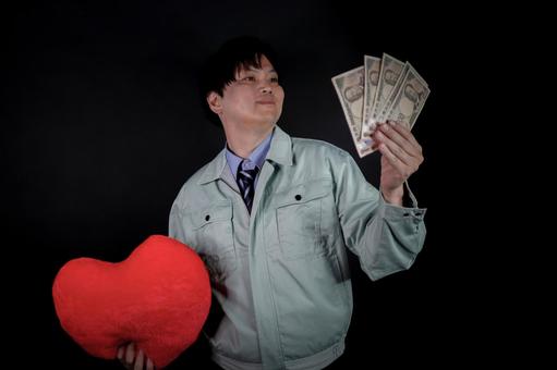 お金とハートを持つ男性 お金とハートを持つ男性 男性,お金,ハートの写真素材