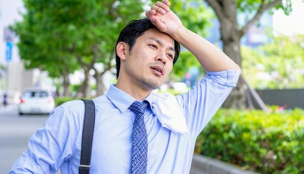 汗ばむビジネスマンの写真