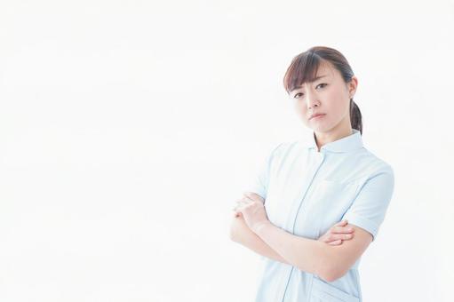 自信がある若い看護師 自信がある若い看護師 診療所,診察室,主任の写真素材