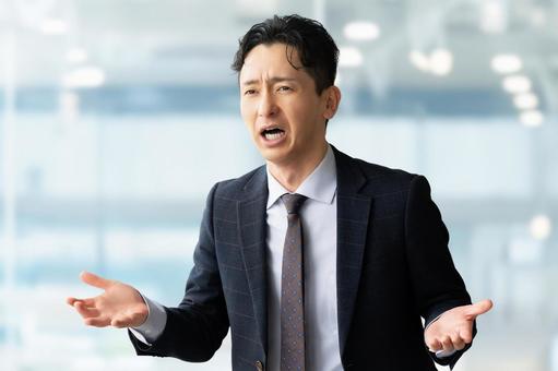 説明・抗議・弁解をする男性ビジネスマン 説明・抗議・弁解をする男性ビジネスマン 男性,ビジネス,ビジネスマンの写真素材