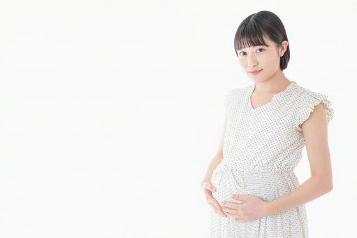 妊娠した若い女性 妊娠した若い女性 育児,帝王切開,白バックの写真素材