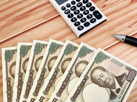 Money and calculator (wooden desk background), JPG