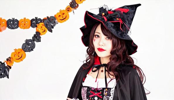 ハロウィン仮装 魔女に扮する女性 白背景 ハロウィン仮装 魔女に扮する女性 白背景の写真