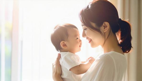 見つめ合う母親と赤ちゃん 見つめ合う母親と赤ちゃんの写真