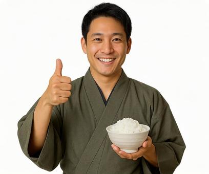 作務衣の男性が茶碗のご飯を手に笑顔 作務衣の男性が茶碗のご飯を手に笑顔の写真