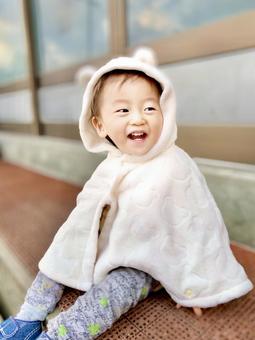 くまみみのポンチョ 子ども,赤ちゃん,男の子の写真素材