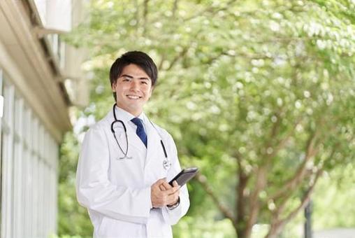 Doctor standing with a smile on a green background, a doctor, doctor, male, JPG