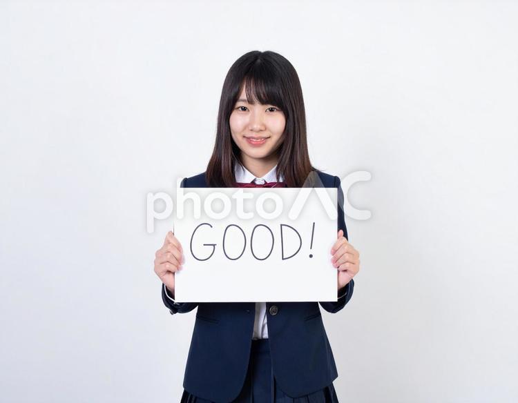GOODと書いたボードをもつ生徒 good,ボード,生徒の写真素材