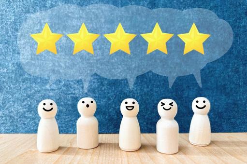 五つ星の評価をつける人々 星,スター,評価の写真素材