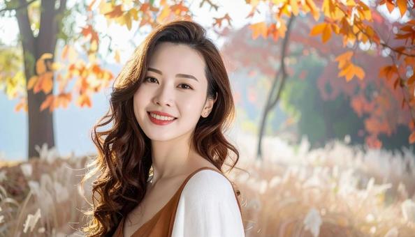 秋の紅葉を背に立つ日本人の女性 秋の紅葉を背に立つ日本人の女性の写真