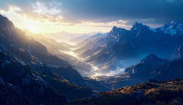 朝靄に包まれる山岳風景の写真