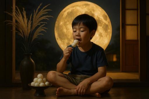 満月を背景に団子を食べる少年 満月を背景に団子を食べる少年の写真