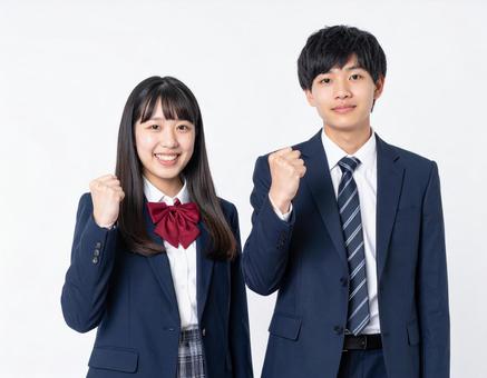 ガッツポーズする男子生徒と女子生徒 ガッツポーズする男子生徒と女子生徒の写真