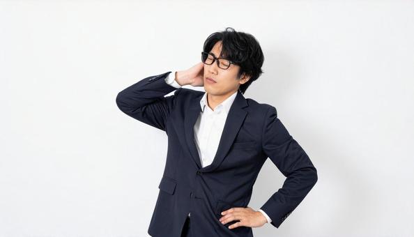 ビジネスイメージ うつむき悩む日本人男性 ビジネスイメージ うつむき悩む日本人男性の写真