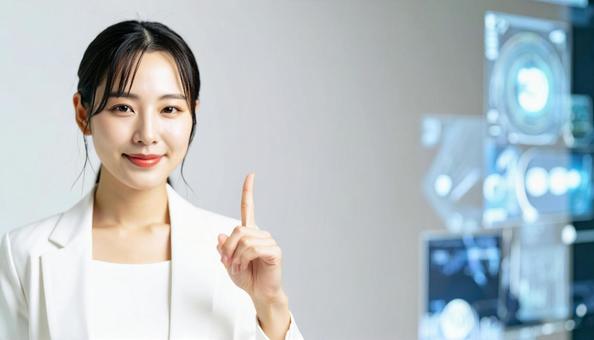 自信のある表情で指さすビジネス女性 自信のある表情で指さすビジネス女性の写真