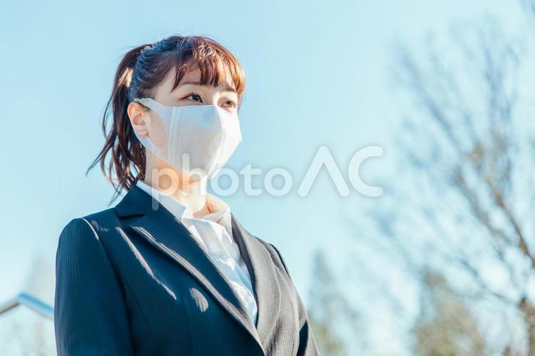 コロナ禍のビジネスウーマン ビジネス,マスク,コロナ禍の写真素材