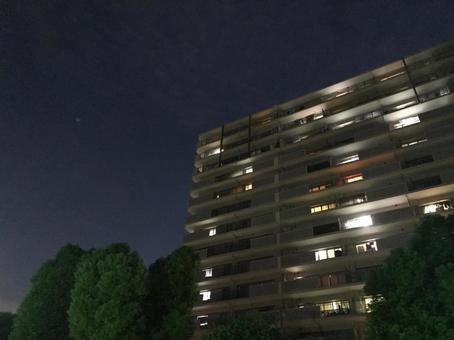 The light of a condominium floating in the night The light of a condominium floating in the night