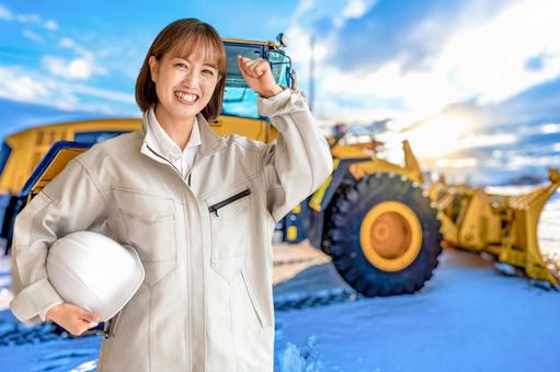 ブルドーザーと女性 ブルドーザーと女性 除雪,除雪車,女性の写真素材