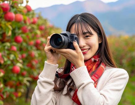 リンゴ畑・旅するカメラ女子 リンゴ畑・旅するカメラ女子の写真